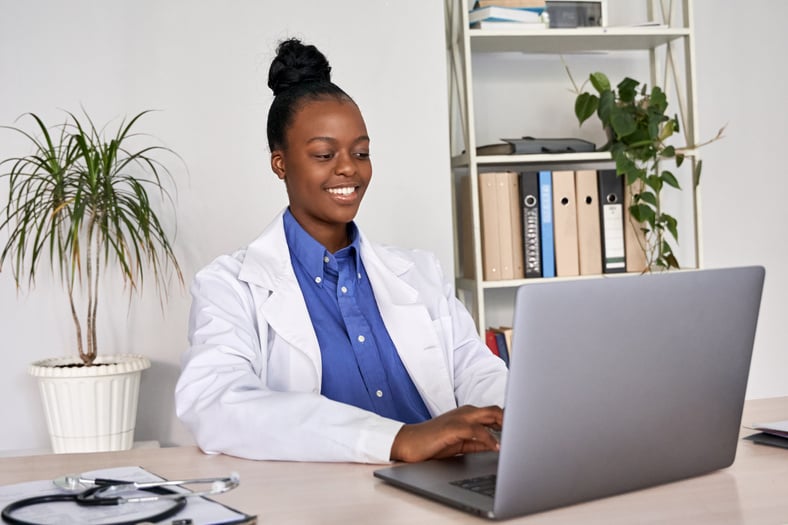 Female Doctor Working on Laptop 