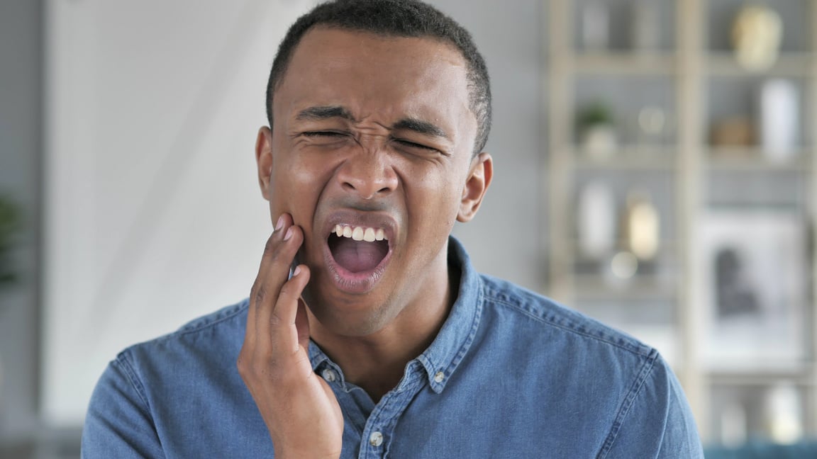 Toothache, Young African Man with Tooth Infection