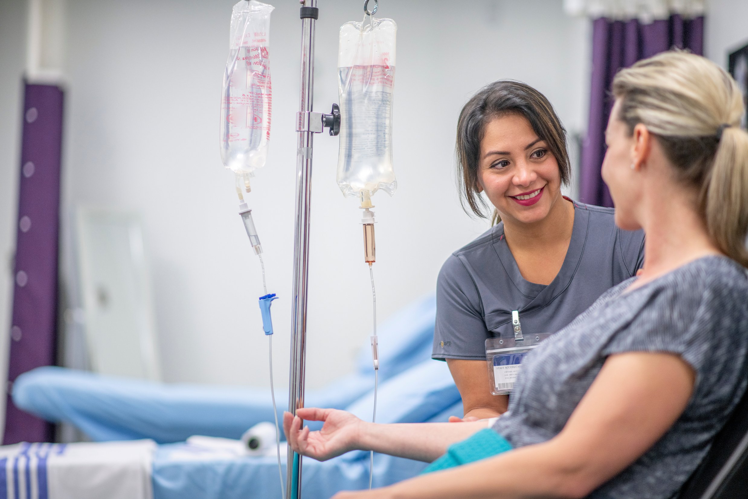 Women receives IV drip treatment